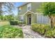 Well-maintained home exterior with a walkway leading to the front door and a well-manicured lawn at 2430 Little Gem Loop, Sanford, FL 32773