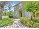 Inviting walkway leading to the front door, surrounded by lush greenery and landscaping at 2430 Little Gem Loop, Sanford, FL 32773