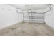 Spacious garage with an automatic door and ample space for parking and storage at 2430 Little Gem Loop, Sanford, FL 32773