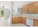 Kitchen with stainless steel appliances, and tile floors adjacent to the living room at 2430 Little Gem Loop, Sanford, FL 32773