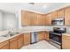 Well-equipped kitchen with stainless steel appliances, ample counter space, and modern cabinetry at 2430 Little Gem Loop, Sanford, FL 32773