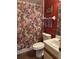 Cozy bathroom featuring floral shower curtain, toilet, and vanity with sink at 25306 Northlake Dr # 25306, Sanford, FL 32773