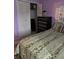 Inviting bedroom with closet, dresser, bed, and decorative artwork at 25306 Northlake Dr # 25306, Sanford, FL 32773