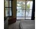 Cozy bedroom with lake view from the balcony at 25306 Northlake Dr # 25306, Sanford, FL 32773