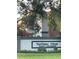 Northlake Village Private Condominium complex with a sign and mature landscaping at 25306 Northlake Dr # 25306, Sanford, FL 32773