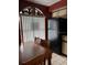 Dining area with black refrigerator, tile floors and window with blinds at 25306 Northlake Dr # 25306, Sanford, FL 32773