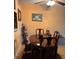 Cozy dining room with wooden table, chairs, and stylish decor, illuminated by a ceiling fan with lights at 25306 Northlake Dr # 25306, Sanford, FL 32773