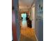 Hallway leading to living area with ceiling fan and sliding doors to balcony at 25306 Northlake Dr # 25306, Sanford, FL 32773