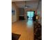 Spacious living room featuring hardwood floors, a fireplace, and access to an outdoor patio at 25306 Northlake Dr # 25306, Sanford, FL 32773