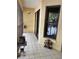 Outdoor porch featuring tiled floors, and view of the nearby lake and trees at 25306 Northlake Dr # 25306, Sanford, FL 32773
