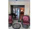 Porch featuring wicker furniture and partial view of the inside dining area at 25306 Northlake Dr # 25306, Sanford, FL 32773