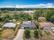 Aerial view of a charming home with a screened pool and a spacious, treed lot at 2550 Meadowview Ln, Deland, FL 32720
