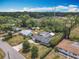 Aerial view of a charming home with a screened pool and a spacious, treed lot at 2550 Meadowview Ln, Deland, FL 32720