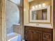 Bathroom featuring a modern vanity and tiled shower at 2550 Meadowview Ln, Deland, FL 32720