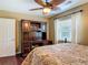 Bedroom with desk, ceiling fan and window at 2550 Meadowview Ln, Deland, FL 32720
