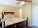 Well-lit bedroom features hard wood floors and a ceiling fan at 2550 Meadowview Ln, Deland, FL 32720