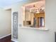 Bright kitchen with granite counters and a view into the living room at 2550 Meadowview Ln, Deland, FL 32720