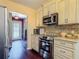 The kitchen offers modern appliances, stylish countertops and is brightly lit at 2550 Meadowview Ln, Deland, FL 32720