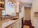 A partial view of the kitchen with light stone countertops and modern finishes at 2550 Meadowview Ln, Deland, FL 32720