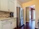 The kitchen is modern with stainless steel appliances and granite countertops at 2550 Meadowview Ln, Deland, FL 32720