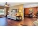 Comfortable living room with wood floors flowing into adjacent dining area at 2550 Meadowview Ln, Deland, FL 32720