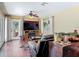 Cozy living room featuring a fireplace, large windows, and comfortable seating at 2550 Meadowview Ln, Deland, FL 32720