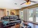 Comfortable living room with french doors and views of the kitchen at 2550 Meadowview Ln, Deland, FL 32720