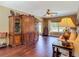 The living room includes hardwood floors, large hutch, and bright window at 2550 Meadowview Ln, Deland, FL 32720