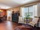 Bright room with hardwood floors, multiple windows, and views of the pool at 2550 Meadowview Ln, Deland, FL 32720