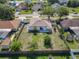 An aerial view of the backyard featuring lush greenery, a privacy fence and mature trees at 2620 Abbey Ave, Orlando, FL 32833