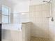 Bathroom featuring a bathtub and tiled shower at 2620 Abbey Ave, Orlando, FL 32833