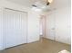 Bedroom featuring a closet, tiled floors, and access to another room at 2620 Abbey Ave, Orlando, FL 32833