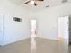 Large bedroom with tiled floor, a ceiling fan, and adjoining bathroom at 2620 Abbey Ave, Orlando, FL 32833