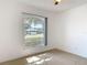 Bedroom featuring tile floor and a large window view at 2620 Abbey Ave, Orlando, FL 32833