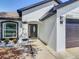 Inviting front entrance with a modern door, manicured landscaping, and well lit entrance at 2620 Abbey Ave, Orlando, FL 32833