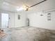Spacious garage with laundry hookups and painted block walls at 2620 Abbey Ave, Orlando, FL 32833