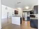 Open kitchen featuring stainless steel appliances, breakfast bar and ample cabinet space at 2620 Abbey Ave, Orlando, FL 32833