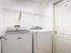 Laundry room with a washer and dryer and wire shelving at 2620 Abbey Ave, Orlando, FL 32833