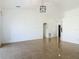 Spacious living room with tile flooring, a modern light fixture and ample natural light at 2620 Abbey Ave, Orlando, FL 32833