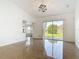Bright living room with tile floors and sliding glass doors to backyard patio at 2620 Abbey Ave, Orlando, FL 32833
