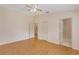 Large bedroom with hardwood floors, a walk-in closet and an adjoining bathroom at 2714 Moncayo Ave, The Villages, FL 32162
