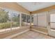 Enclosed lanai featuring tile flooring, neutral paint, and large windows at 2714 Moncayo Ave, The Villages, FL 32162