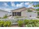 Charming single-story home featuring a welcoming screened lanai and a neat white picket fence at 2714 Moncayo Ave, The Villages, FL 32162