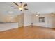 Spacious living area with laminate floors, ceiling fans, and an open layout at 2714 Moncayo Ave, The Villages, FL 32162