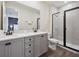 Modern bathroom with a double vanity, walk-in shower, and sleek fixtures at 2920 On The Rocks Pt, Kissimmee, FL 34747