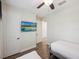 Well-lit bedroom with neutral color palette and laminate flooring at 2920 On The Rocks Pt, Kissimmee, FL 34747