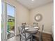 Cozy dining area with access to outdoor patio and backyard at 2920 On The Rocks Pt, Kissimmee, FL 34747