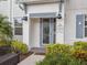 Inviting front entrance with stylish door, decorative address sign, and manicured landscaping at 2920 On The Rocks Pt, Kissimmee, FL 34747