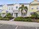 Townhouse exterior showcasing a charming facade, well-kept landscaping, and front entrance at 2920 On The Rocks Pt, Kissimmee, FL 34747