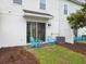 Relaxing patio with blue Adirondack chairs perfect for outdoor enjoyment and leisure at 2920 On The Rocks Pt, Kissimmee, FL 34747